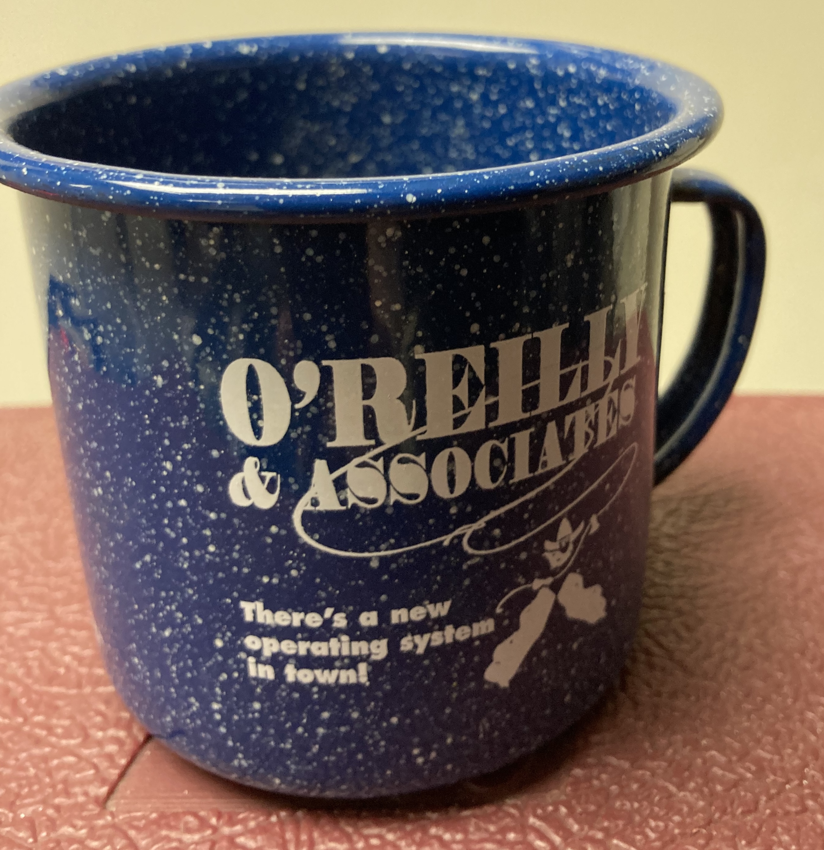 Imitation of an old West drinking cup advertising the O'Reilly Linux series