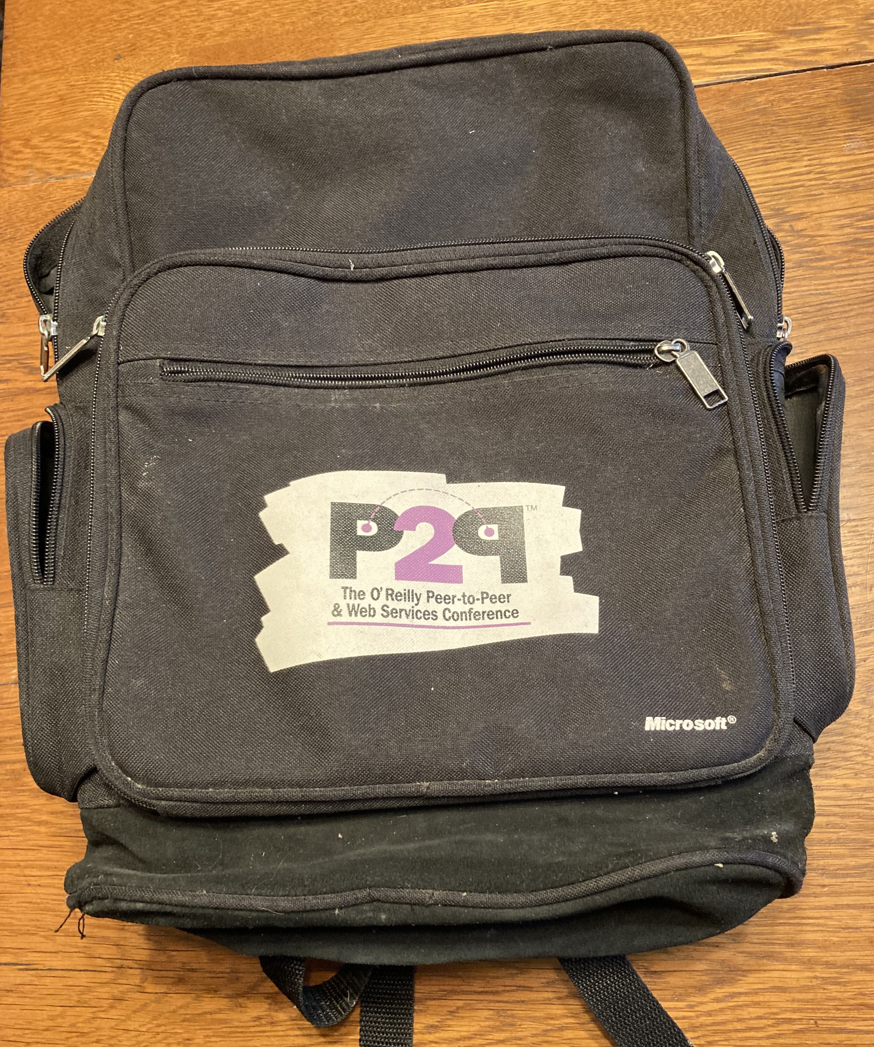 A backpack handed out as swag at the Peer-to-Peer conference in February 2001 shows \