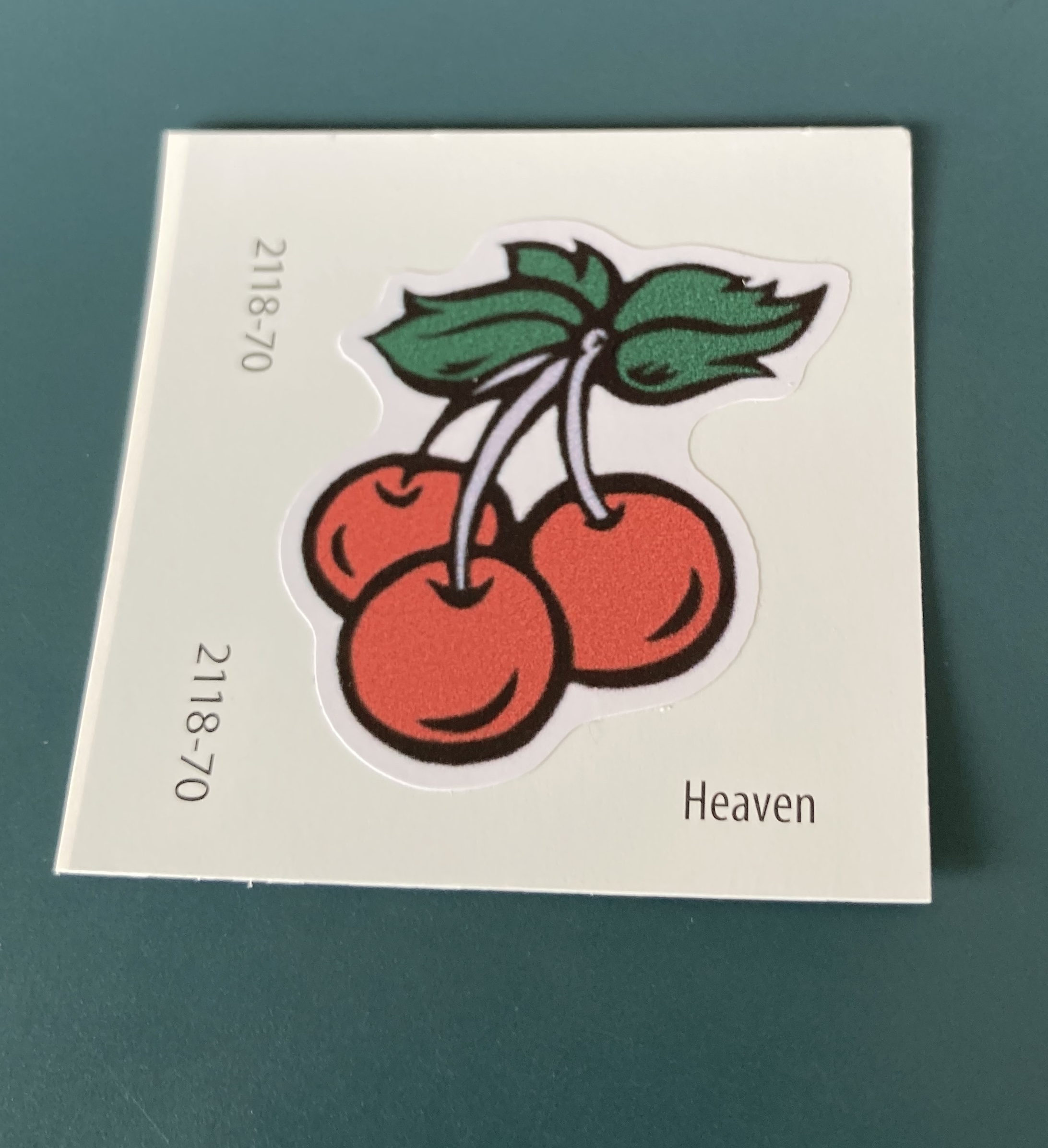 [Benjamin Moore paint chip, color called Heaven, with sticker of cherries]