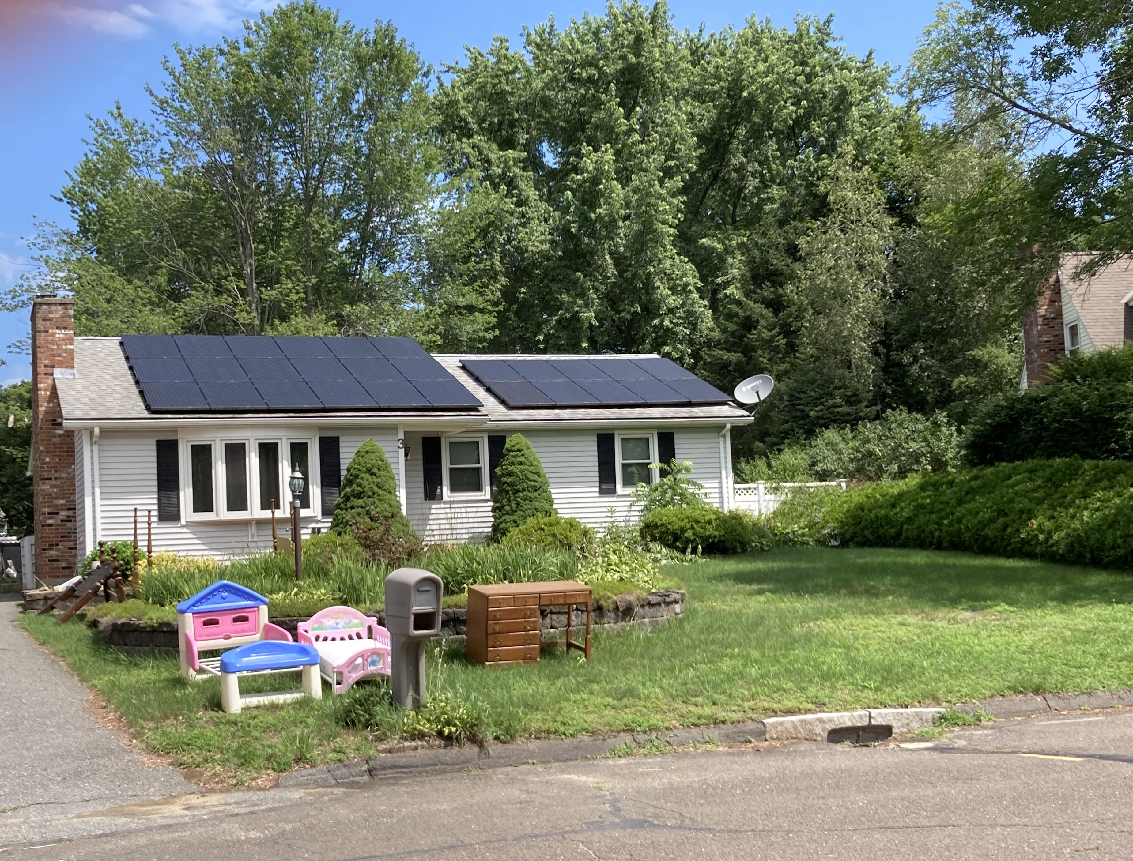 [Photograph of lawn with artifacts]